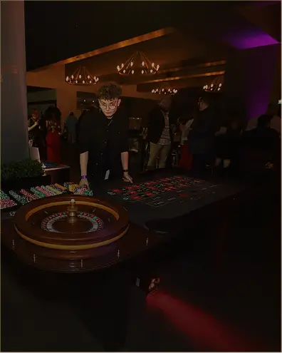 Outdoor casino party setup under string lights in Austin